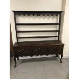 A late 18TH/early 19th century oak three drawer dresser