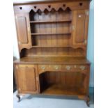 An Edwardian oak kitchen dresser with cupboards to base and rack.22"x67"x89"h