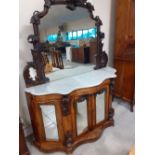 A mid Victorian carved Walnut and mahogany chiffonier with mirrored back & marble top. 20"x59"x77"h