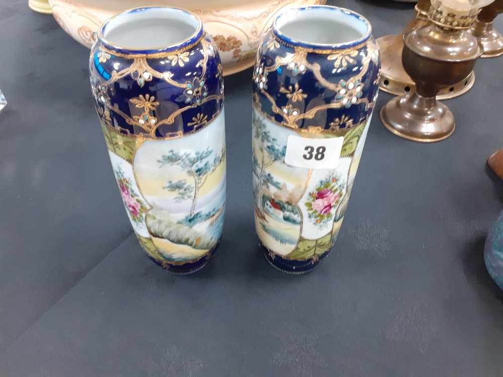 A pair of Nipon china hand painted vases (one chipped)