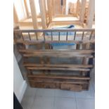 A Victorian pine plate rack with two drawers.