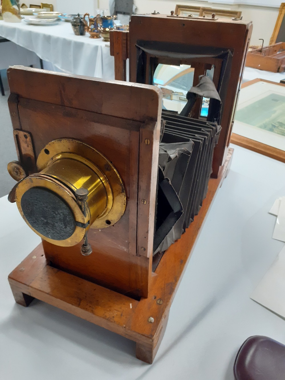 A 19th century wood and brass cased folding camera bellows damaged) 20" extended.