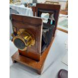 A 19th century wood and brass cased folding camera bellows damaged) 20" extended.