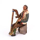 Neapolitanische Krippenfigur: Sitzender Mann mit Harfe