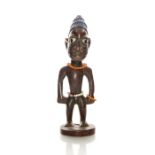 NIGERIAN WOOD SCULPTURE OF MAN WITH BEADS