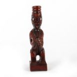 MAORI HAND CARVED WOOD FIGURE WITH PAUA SHELL EYES