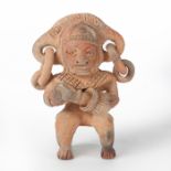 EARTHENWARE FIGURE HOLDING POTTERY