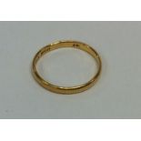 A 22 carat gold small wedding band. Approx. 1.6 gr