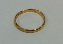 A 22 carat gold small wedding band. Approx. 1.6 gr