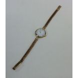 A lady's 9 carat wristwatch on mesh strap. Approx.