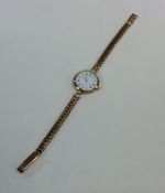 A lady's 9 carat wristwatch on mesh strap. Approx.