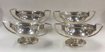 A good set of four Georgian silver salts with reed