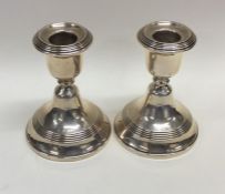 A pair of circular modern silver candlesticks. Bir