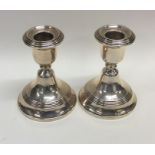 A pair of circular modern silver candlesticks. Bir