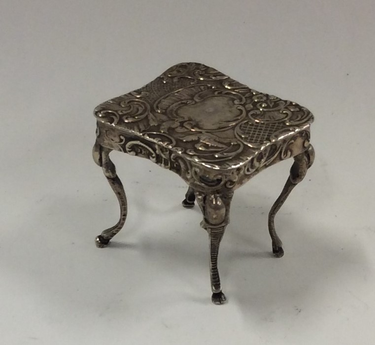 A novelty miniature silver table decorated with bi