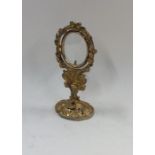 A small silver gilt Continental picture frame on o