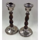 A pair of silver barley twist candlesticks. Approx