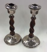 A pair of silver barley twist candlesticks. Approx