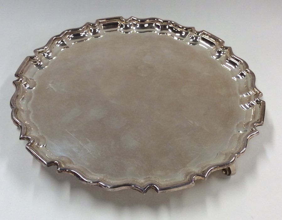 A plain silver circular salver. London. By Mappin