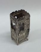 A silver model of a sedan chair in typical form. A