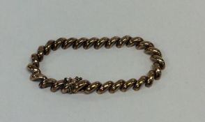 A 9 carat curb link bracelet with concealed clasp.