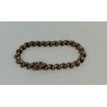 A 9 carat curb link bracelet with concealed clasp.