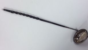 A Georgian silver toddy ladle with twisted whalebo