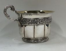 A Georgian silver and silver gilt cup decorated wi