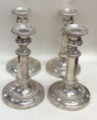 A good set of four Georgian silver candlesticks wi