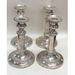 A good set of four Georgian silver candlesticks wi