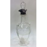 A stylish silver dimple sided decanter with silver