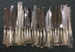 A good set of modern cast silver knives with steel