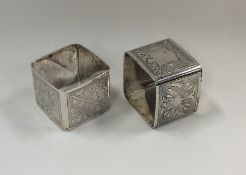 A pair of Victorian silver napkin rings decorated