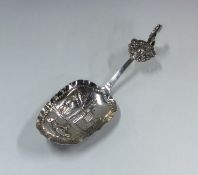 A Continental silver spoon decorated with figures.