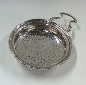 A good Georgian silver lemon strainer with pierced