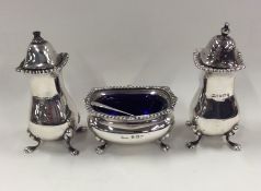 A silver Adams' style three piece cruet with gadro