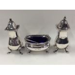 A silver Adams' style three piece cruet with gadro