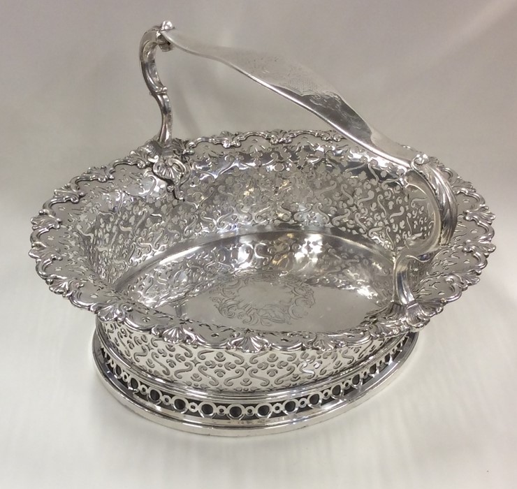 A heavy Georgian silver basket attractively decora