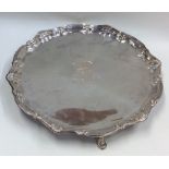 A heavy Georgian silver salver with crested centre