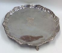 A heavy Georgian silver salver with crested centre