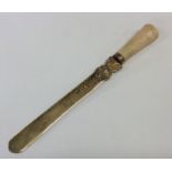 A Victorian silver gilt tapering letter opener wit