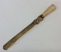 A Victorian silver gilt tapering letter opener wit