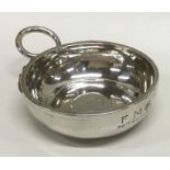 A French 19th Century silver wine taster with snak