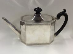 A good quality Georgian silver teapot with cut cor