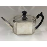 A good quality Georgian silver teapot with cut cor