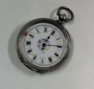 A small Continental silver fob watch with engraved