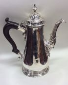 A massive Georgian silver coffee pot with crested