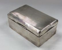 An engine turned silver cigarette box with hinged