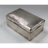 An engine turned silver cigarette box with hinged