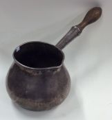 A massive Queen Anne silver brandy pan with turned